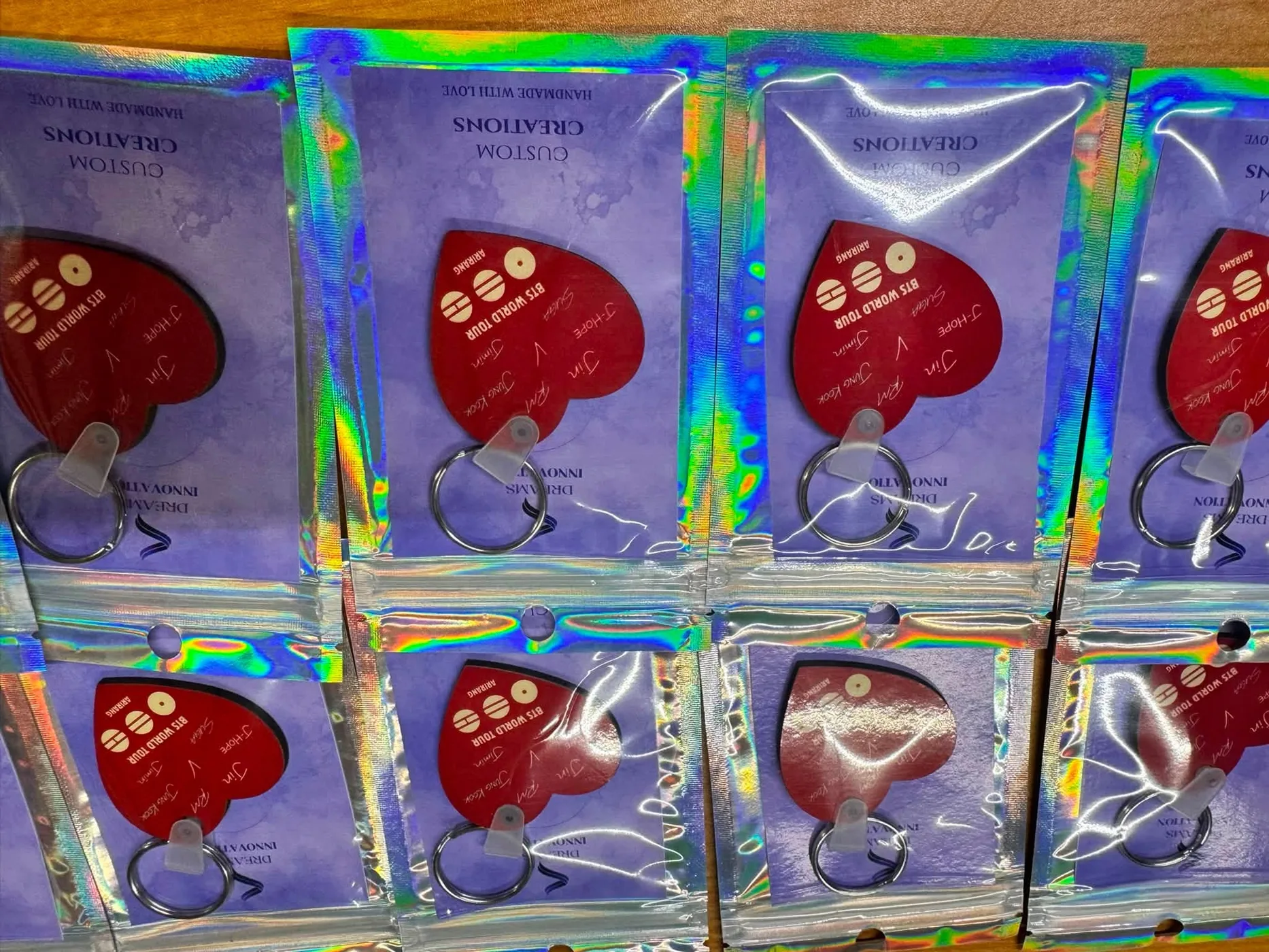 Heart-shaped personalized concert keychains in gift packaging